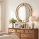 Gold round wall mirror with beaded frame, 28 inches, ideal for living room or entryway decor.