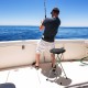 Portable 28-inch folding stool with sturdy frame, ideal for fishing, featuring a wide seat and footrests for comfort.