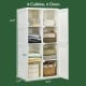 Foldable armoire wardrobe closet with 8 cubby storage and 6 doors, ideal for compact living spaces and organization.