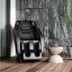Full body zero gravity massage chair in black with SL track, designed for ultimate comfort and relaxation.