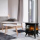 Freestanding electric fireplace heater in black with realistic flame effect, perfect for cozy living room ambiance.