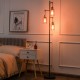 Retro floor lamp with three amber glass shades, stable iron base, perfect for bedroom or living room lighting.