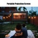 Inflatable outdoor movie projector screen with blower, 14', set up for a backyard movie night with friends.
