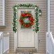 9-foot pre-lit Christmas garland adorned with snow-flocked tips and red berries, ideal for cheerful holiday decoration.