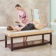Massage bed warmer heating pad shown in use, featuring a soft surface and 5 adjustable heat settings for relaxation.