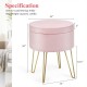 Round pink velvet storage ottoman with gold metal legs, featuring a soft surface and interior storage for versatile use.