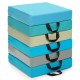 Stack of six colorful 15-inch square toddler floor cushions with handles, featuring waterproof covers and soft foam for.