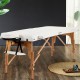 Portable adjustable facial spa bed in white with a sturdy beech frame, ideal for massage and spa treatments.