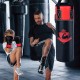 Kids hanging punching bag set with gloves, designed for Karate training, featuring durable materials and thick padding.