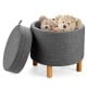 Round gray fabric storage ottoman with removable lid, wooden tray, and plush toys inside, perfect for bedroom.