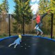8 ft outdoor trampoline with safety net, featuring a sturdy galvanized steel frame and enhanced bounce for kids' fun.