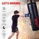 Child practicing boxing with a filled punching bag, featuring professional gloves and a jump rope for training.