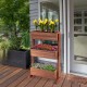 3-tier raised garden bed made of solid wood, featuring detachable shelves and drainage holes for versatile plant.
