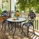 Black steel round table with tempered glass top and umbrella hole, perfect for outdoor patio dining and relaxation.
