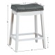 Nailhead saddle bar stool with soft upholstery and rubber wood legs, ideal for kitchen or bar use, 24-inch height.