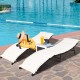 Folding patio lounger chairs in beige with a side table, perfect for poolside relaxation and sunbathing.