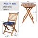 Folding chair and table set made of solid acacia wood with navy cushions, perfect for outdoor bistro dining.