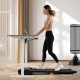 Under desk treadmill in black, featuring a 2.5HP motor, remote control, and LED display for home office workouts.