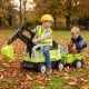 Kids ride-on tractor with digging arm and detachable trailer, designed for outdoor fun and physical development.