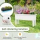 Self-watering planter box in white with drainage hole and detachable legs, ideal for flowers and vegetables outdoors.