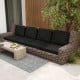 Black outdoor patio sofa with plush cushions, crafted from breathable olefin fabric for comfort and durability.