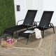 Two adjustable outdoor patio lounge chairs with black fabric and sturdy steel frames, perfect for poolside relaxation.