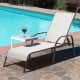 Gray outdoor patio lounge chair with adjustable reclining armrest, perfect for poolside relaxation.