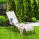 Gray outdoor patio lounge chair with adjustable reclining armrest, set in a lush garden for relaxation and comfort.