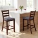 Counter height chairs with fabric seats and rubber wood legs, featuring a vintage design for elegant dining spaces.