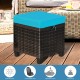 Turquoise cushion on a sturdy rattan ottoman, featuring a removable cover, ideal for outdoor seating or as a footrest.
