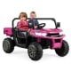 2-seater pink kids ride-on dump truck with tiltable bed, remote control, and safety features for outdoor fun.