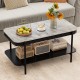 Modern rectangular coffee table with gray sintered stone top and open storage shelf, perfect for stylish living spaces.