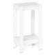 Sleek white 2-tier nightstand featuring solid wood legs and a minimalist design, perfect for enhancing bedroom decor.