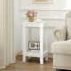 White 2-tier nightstand with solid wood legs, offering ample storage and a stylish design for bedroom or living room use.