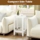 Compact white side table with 2-tier design and wooden legs, perfect for small spaces beside a sofa or bed.