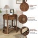 Round end table with wood grain finish, drawer with sleek knob, and lower shelf for decorative items. Ideal for rustic.