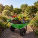 Heavy-duty light green wheelbarrow filled with colorful flowers and soil, ideal for gardening and outdoor use.