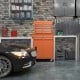 2-in-1 rolling tool chest in orange with five lockable drawers, large storage capacity, and smooth-gliding rails.