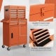 Rolling tool chest in orange with five sliding lockable drawers, durable steel, and large storage capacity for tools.