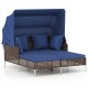Outdoor daybed with retractable canopy in navy, featuring PE wicker rattan and cushioned seating for patio relaxation.