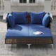 Outdoor daybed with navy cushions, made of PE wicker rattan, perfect for patio relaxation and sunbathing.
