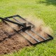 Heavy duty lawn level tool close-up showing the sturdy metal frame and rake plate, designed for efficient leveling.