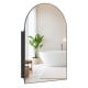 Arched mirror with brushed metal frame and adjustable shelves, perfect for wall-mounted storage in modern bathrooms.