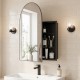 Brushed metal wall-mounted storage cabinet with arched mirror and adjustable shelves for elegant bathroom organization.
