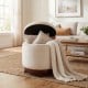 Beige 360° swivel velvet footrest with hidden storage, featuring a solid acacia wood frame for versatile living room.