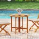 Round 36-inch outdoor folding dining table made of acacia wood, perfect for backyard gatherings by the pool.