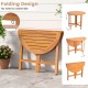 Outdoor folding round dining table made of acacia wood, featuring a slatted tabletop, ideal for backyard gatherings.
