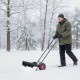 36-inch wheeled snow shovel with adjustable angle and ergonomic handle for efficient snow removal in winter conditions.