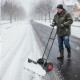 36-inch wheeled snow shovel with adjustable angle and ergonomic handle, designed for efficient snow removal on.