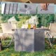 Gray 39-gallon deck box with a lockable lid and cut-out handles, perfect for patio storage or as a stylish table.